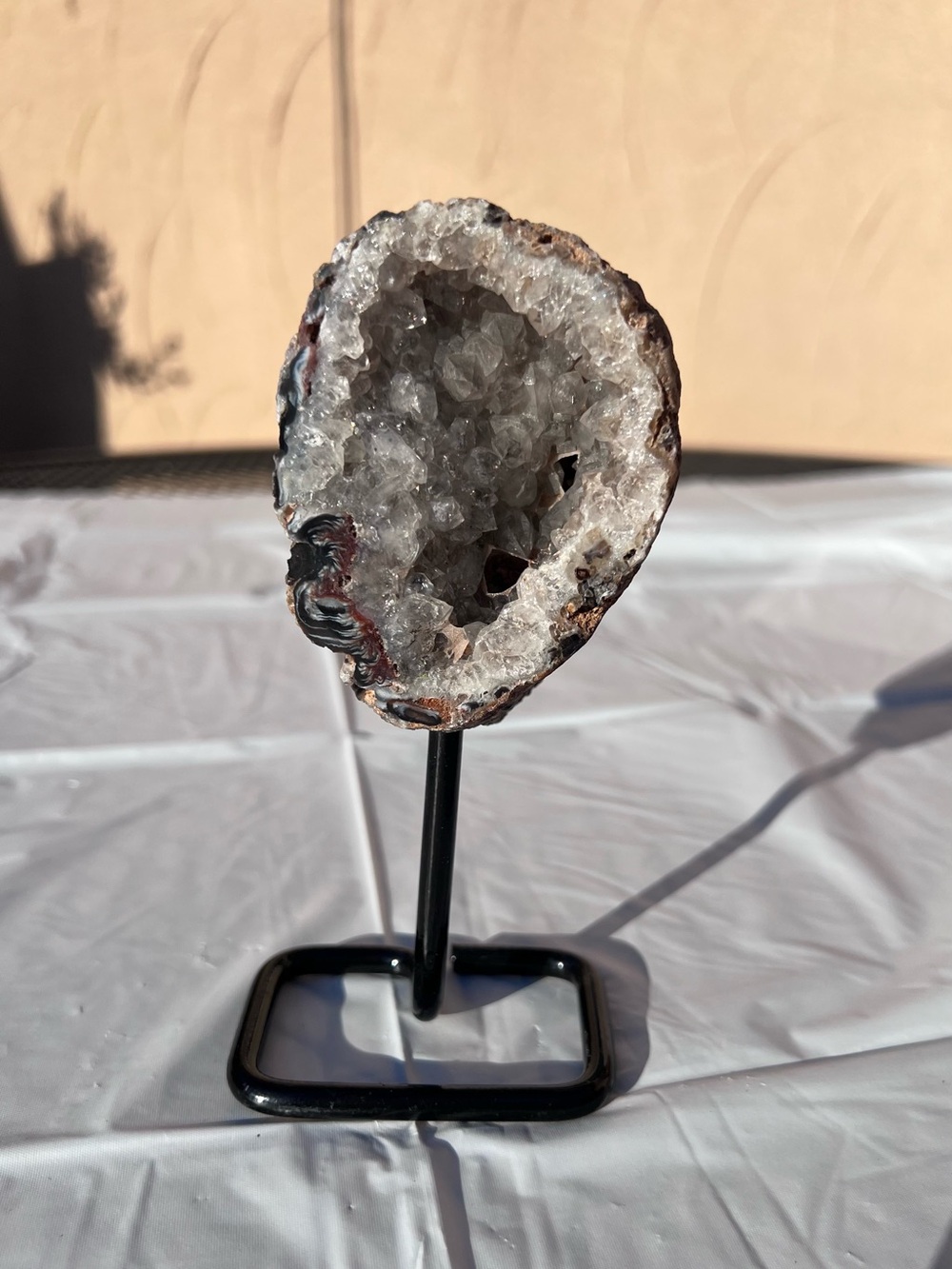 Natural Clear Quartz Geode Display on Black Stand